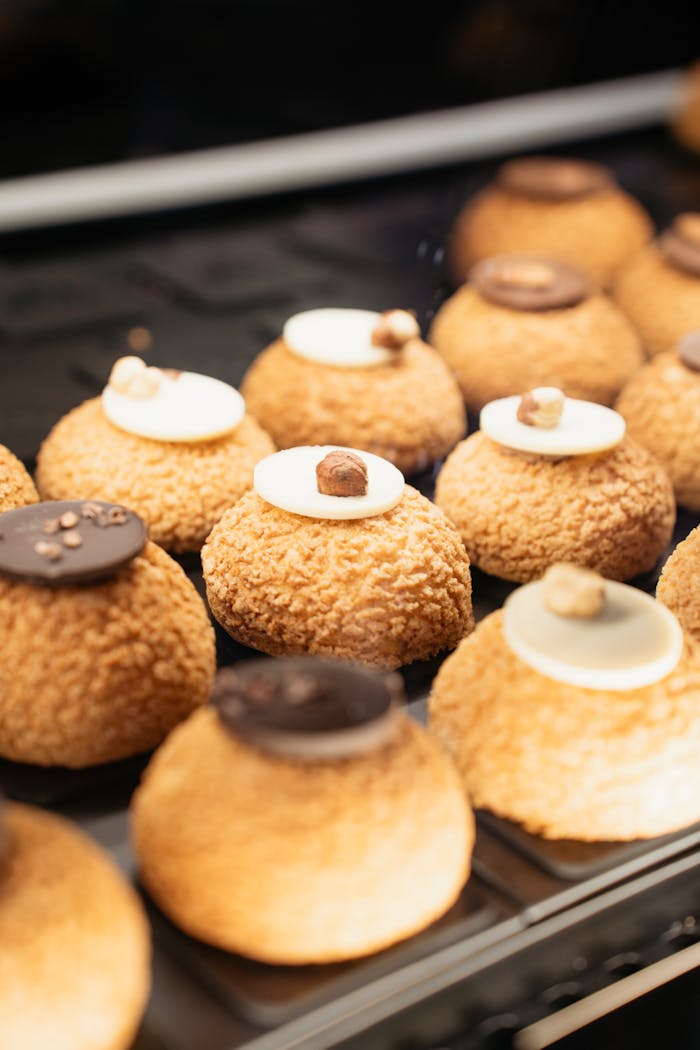 Delicious European desserts with creamy toppings displayed in a Belgrade bakery.